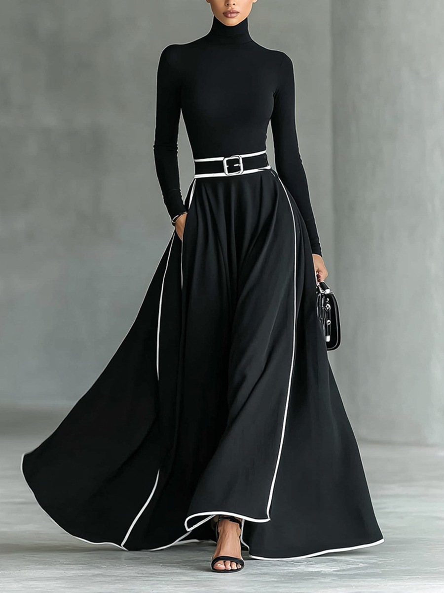 Gina – Vestido maxi de mujer negro con costuras blancas y cuello alto, mangas largas y cintura entallada