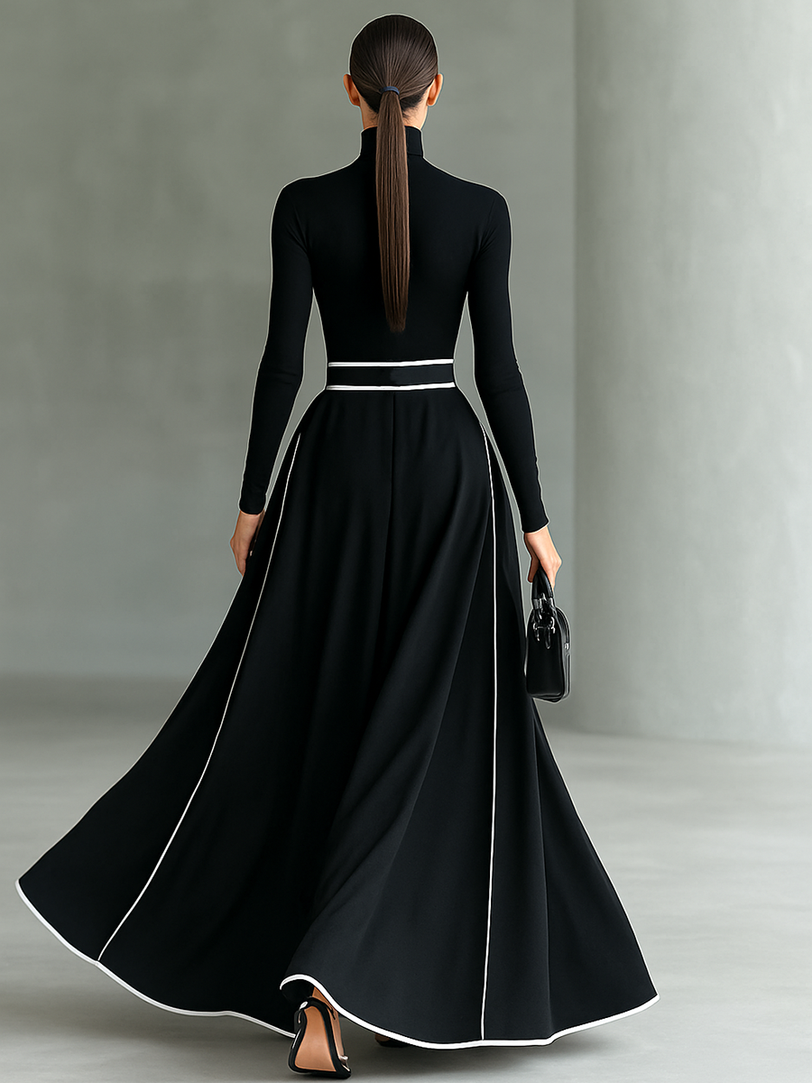 Gina – Vestido maxi de mujer negro con costuras blancas y cuello alto, mangas largas y cintura entallada